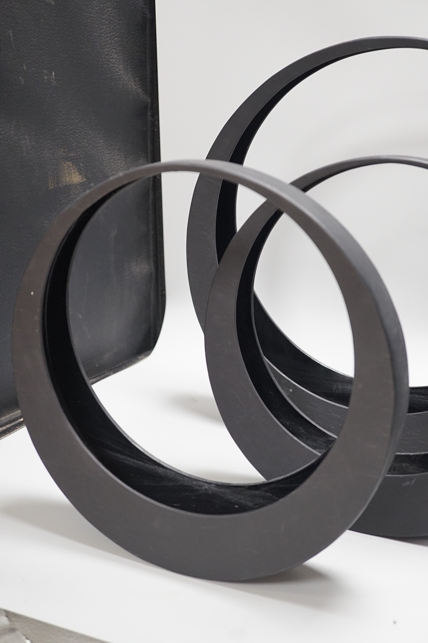 A Japanese bronze bottle vase, 30cm high, three circular black painted wooden abstract sculptures, possibly by Huw Powell Roberts, tallest 42.5cms